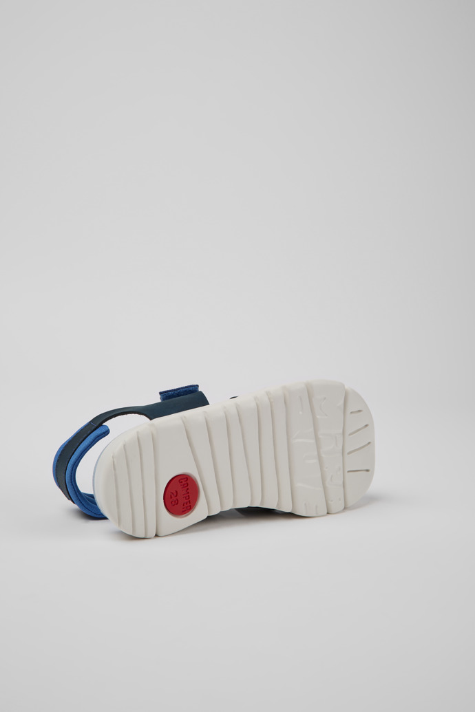 The soles of Oruga Blue leather sandals for kids