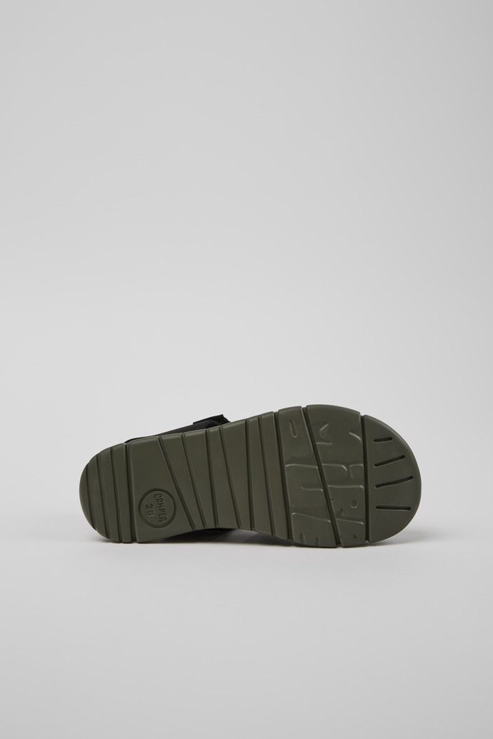 The soles of Oruga # Black Leather and Textile Kids' Sandal.