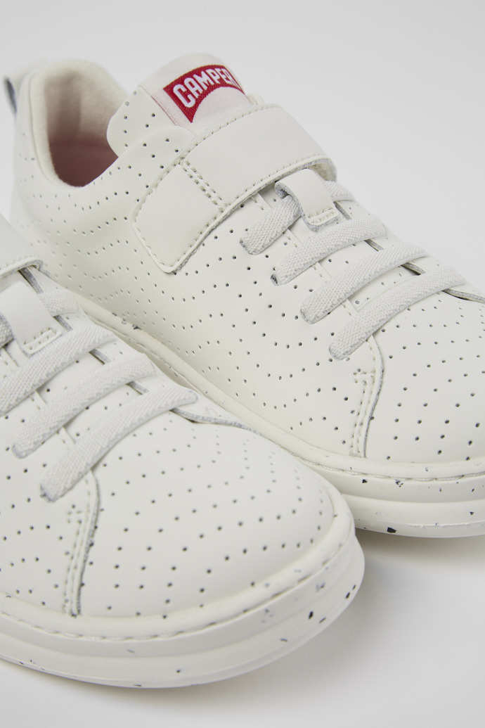 Close-up view of Runner White Leather Sneaker