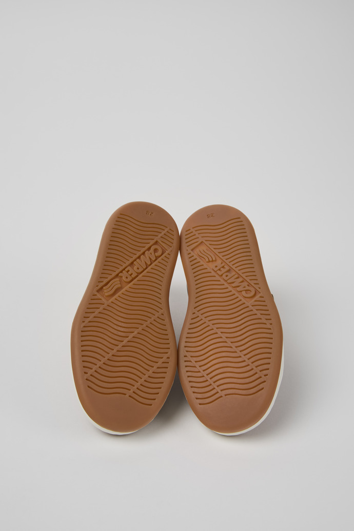 The soles of Runner Brown Leather Kids' Sneaker.