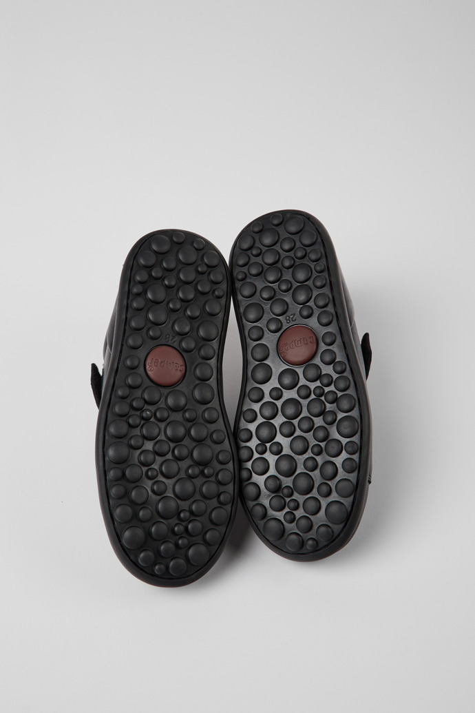 The soles of Pelotas Black leather and textile shoes for kids