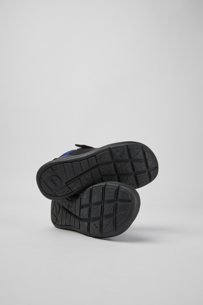 The soles of Ergo Black textile sneakers