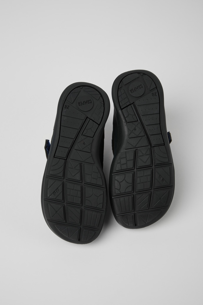 The soles of Ergo Black, blue, and grey nubuck and textile shoes