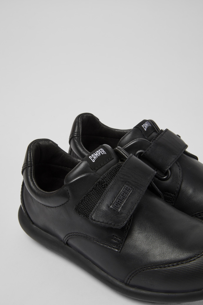 Close-up view of Pelotas Black leather sneakers