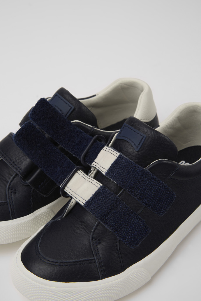 Close-up view of Pursuit Dark blue and white sneakers for kids