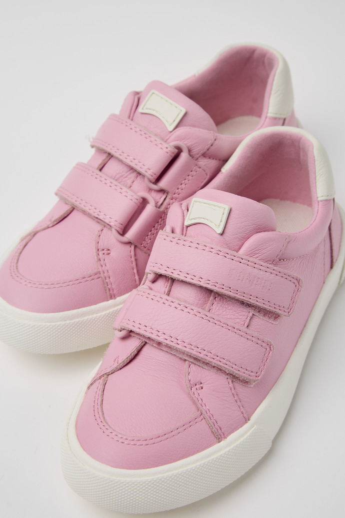 Close-up view of Pursuit Pink and white sneakers for kids
