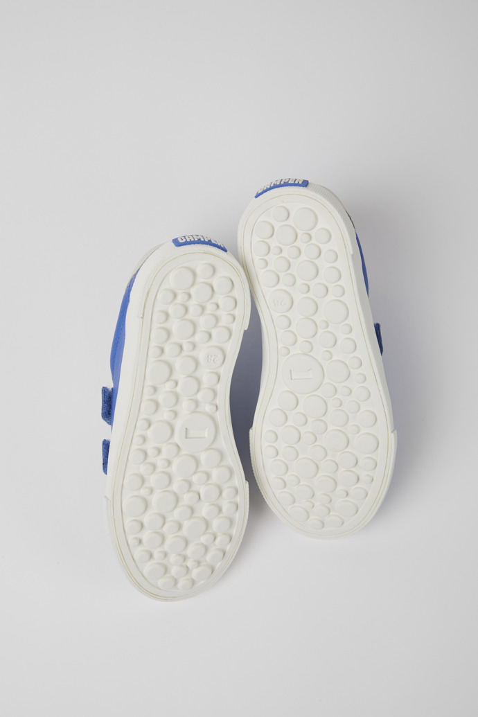 The soles of Pursuit Blue and white sneakers for kids
