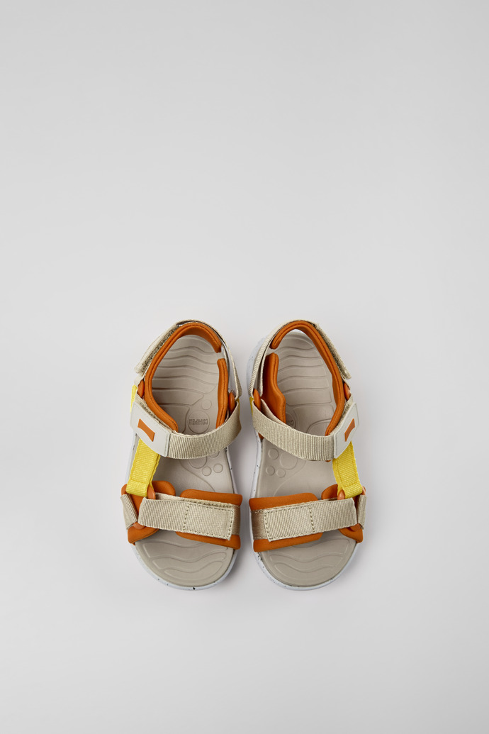 Overhead view of Wous Yellow, orange, and beige sandals for kids