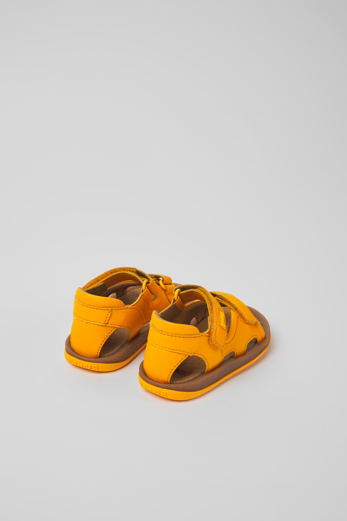 Back view of Bicho Yellow leather sandals for kids