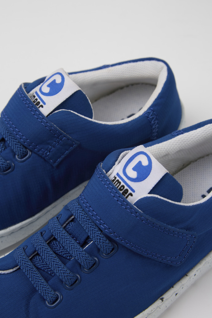 Close-up view of Peu Touring Blue sneakers for kids