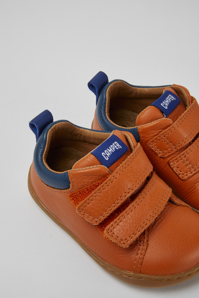 Close-up view of Peu Orange sneakers