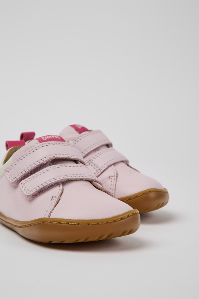 Close-up view of Peu Pink and white leather shoes for girls