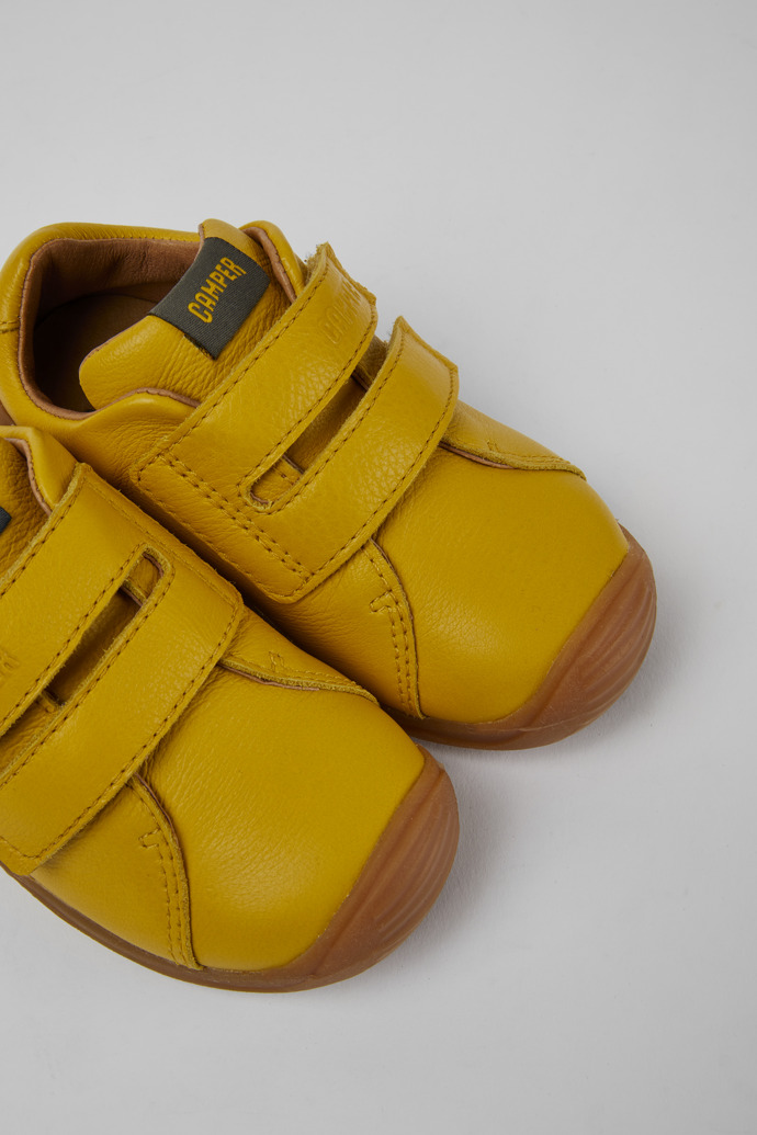 Close-up view of Dadda Yellow leather sneakers