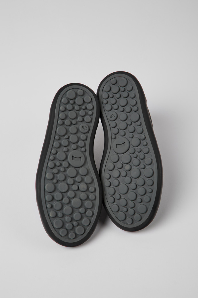 The soles of Pursuit Black leather and nubuck sneakers for kids