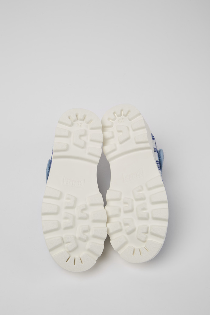 The soles of Brutus Blue and white Mary Jane shoes for kids