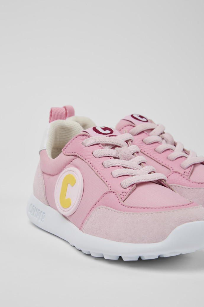 Close-up view of Driftie Pink and white sneakers for girls