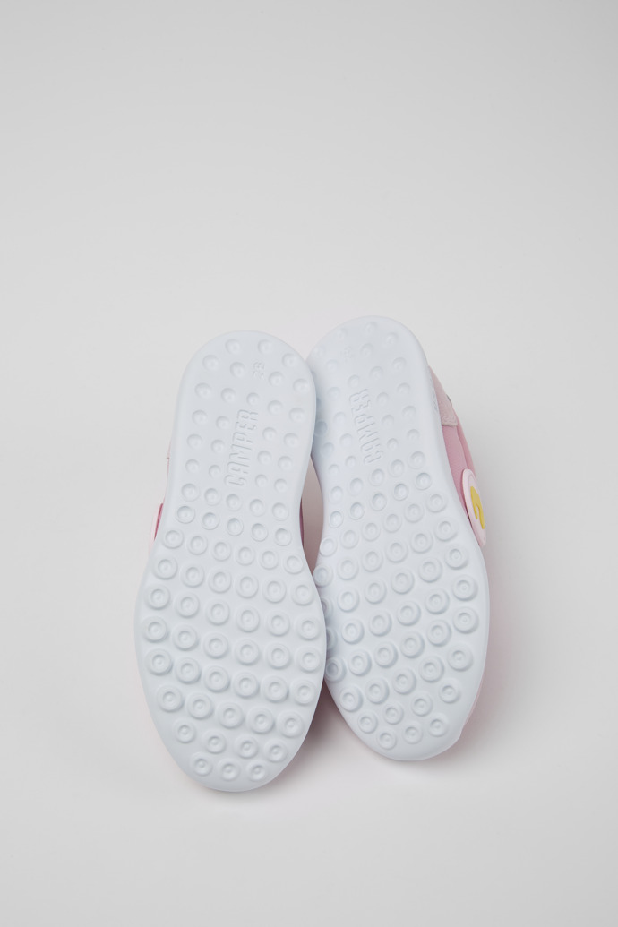 The soles of Driftie Pink and white sneakers for girls