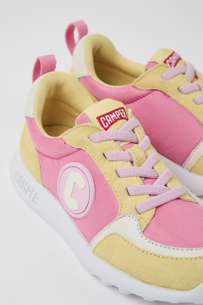 Close-up view of Driftie Yellow and pink textile and nubuck sneakers for kids
