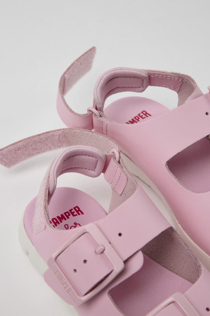 Close-up view of Oruga Pink leather sandals for kids