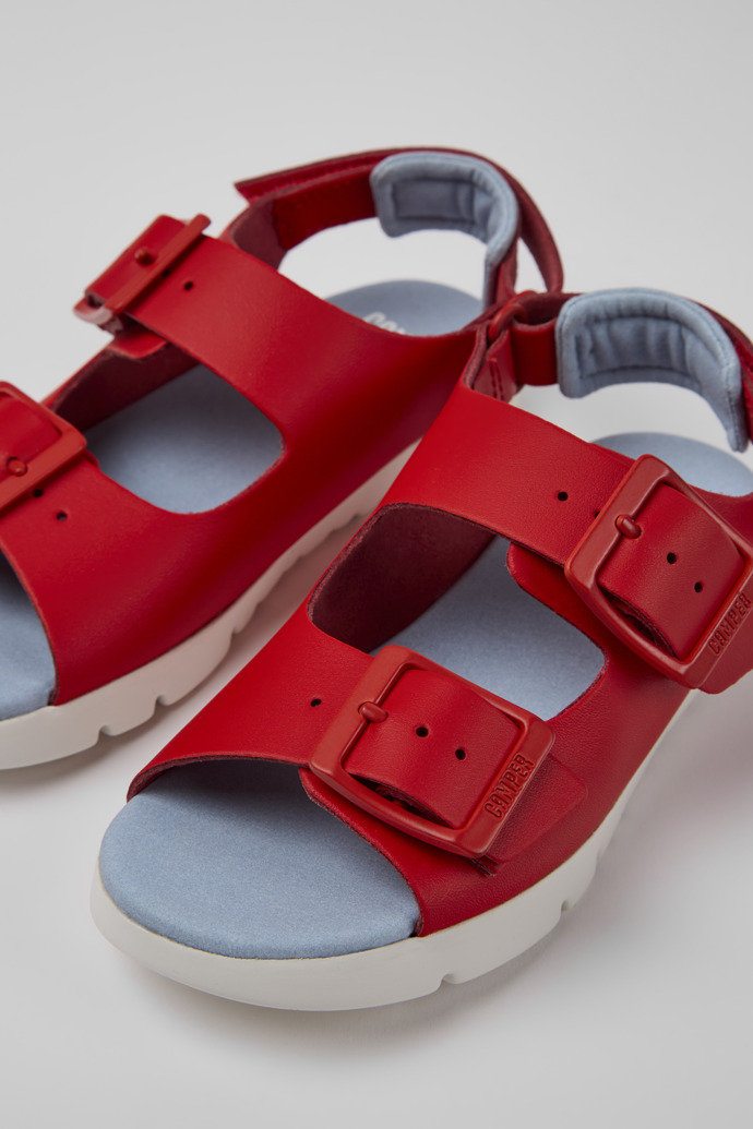 Close-up view of Oruga Red leather sandals for kids