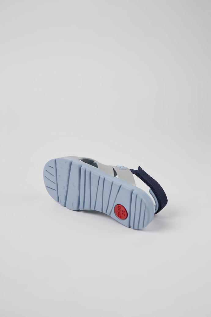 The soles of Oruga Grey leather and textile sandals for kids