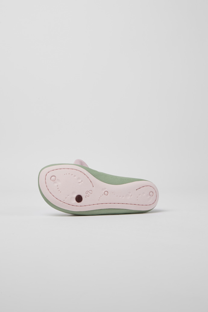 The soles of Right Green and pink ballerinas for girls