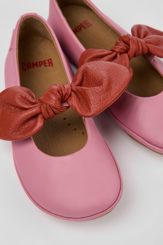 Close-up view of Right Pink and red ballerinas for kids