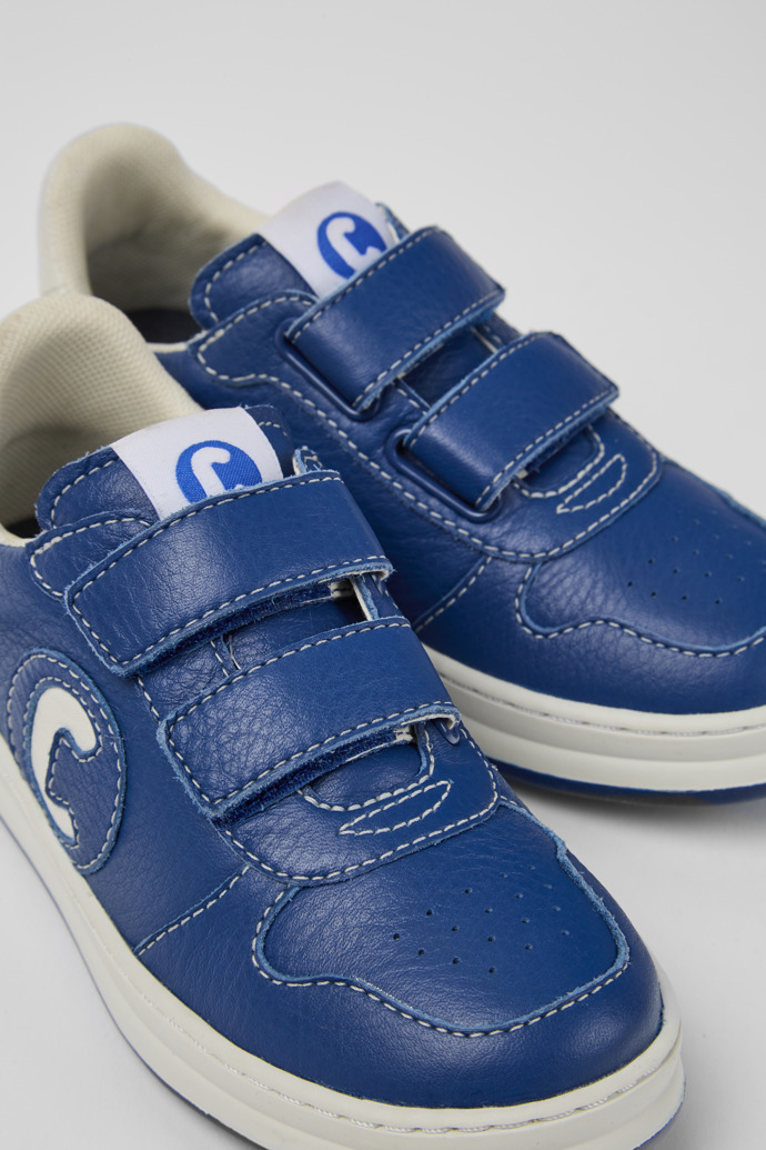 Close-up view of Runner Blue and white leather sneakers for kids