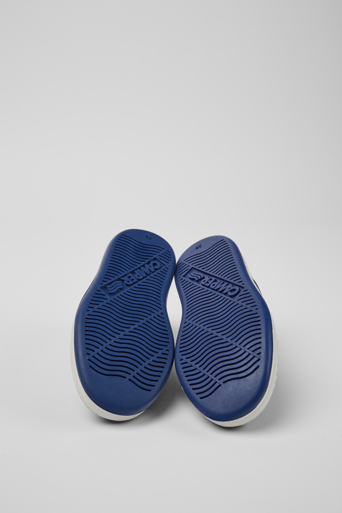 The soles of Runner Blue and white leather sneakers for kids