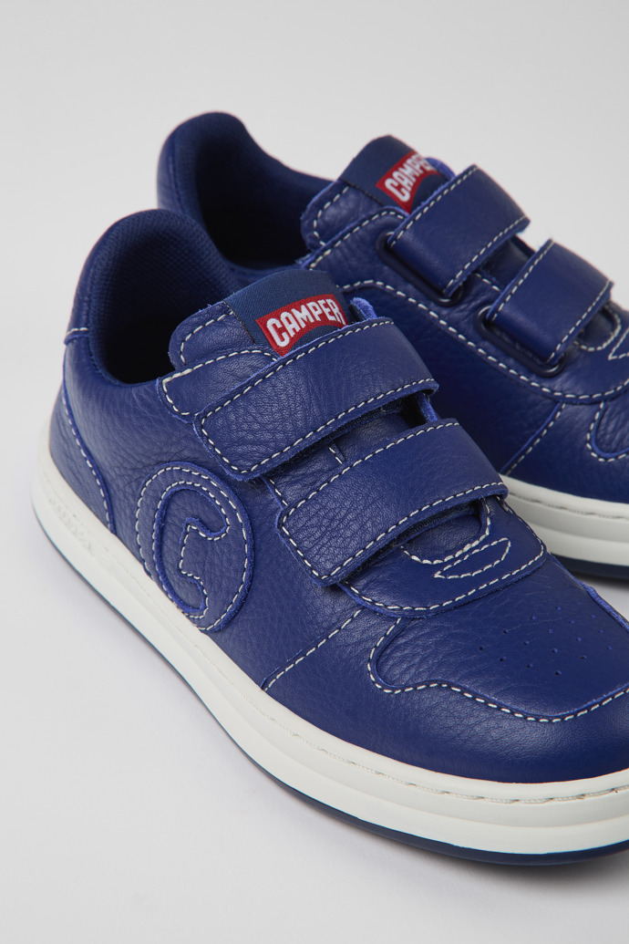 Close-up view of Runner Blue leather sneakers