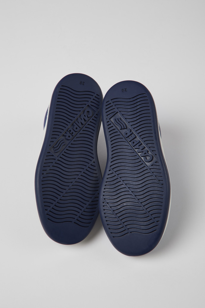 The soles of Runner Blue leather sneakers