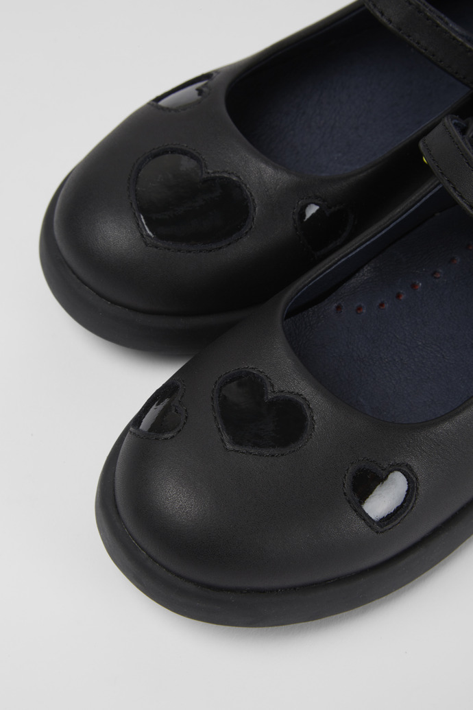 Close-up view of Twins Black leather shoes