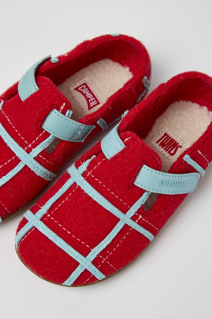 Close-up view of Twins Red natural wool slippers