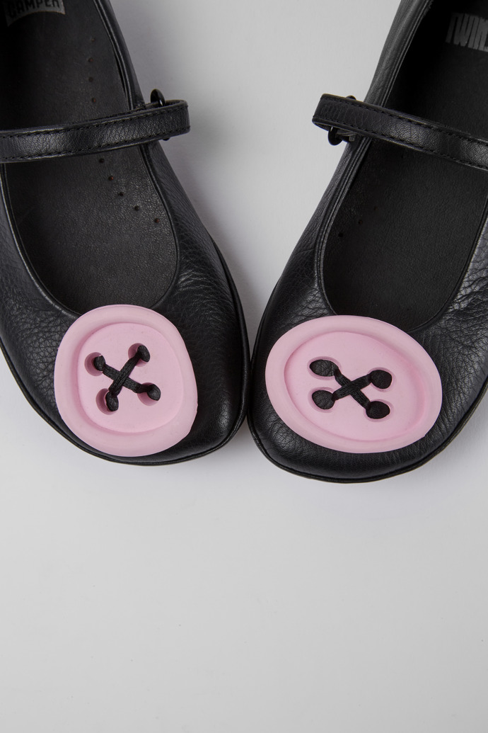 Close-up view of Twins Black leather shoes