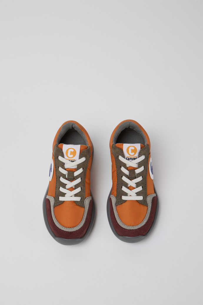 Overhead view of Driftie Orange and red sneakers