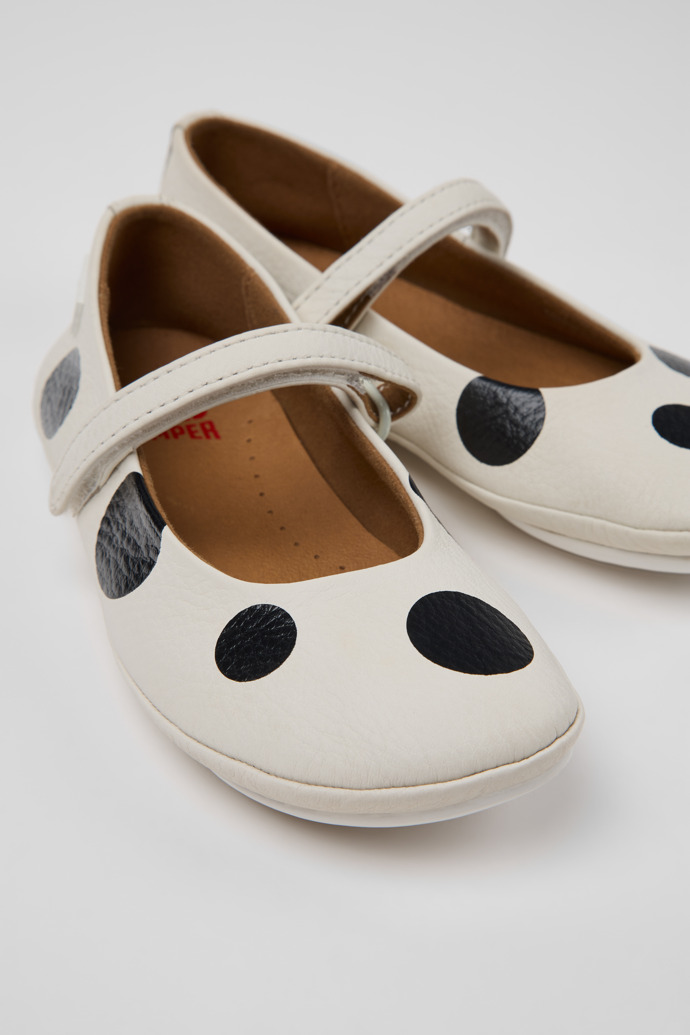 Close-up view of Twins White and Black Leather Ballerinas for kids.