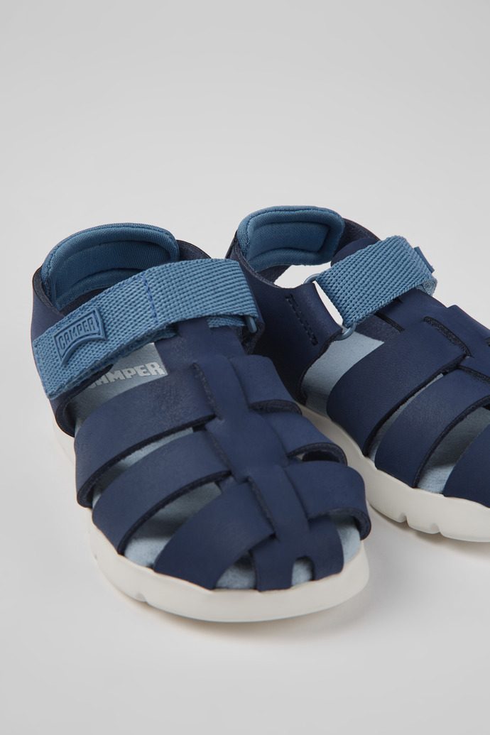 Close-up view of Oruga Blue leather and textile sandals for kids