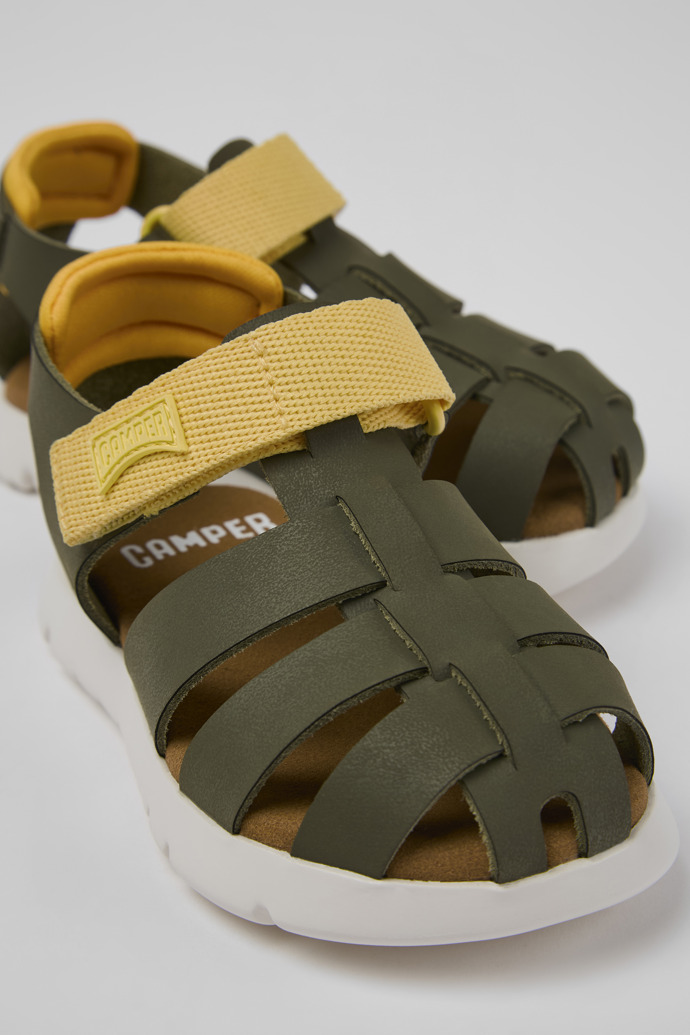 Close-up view of Oruga Green leather and textile sandals for kids