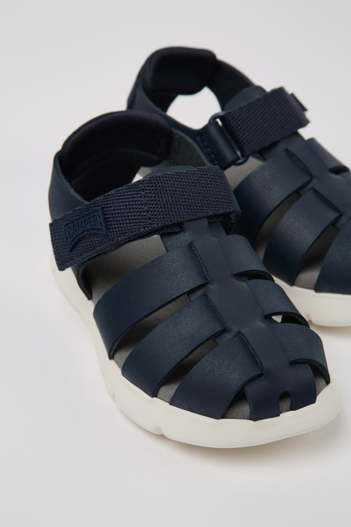 Close-up view of Oruga Blue Leather Kids' Closed Sandals.