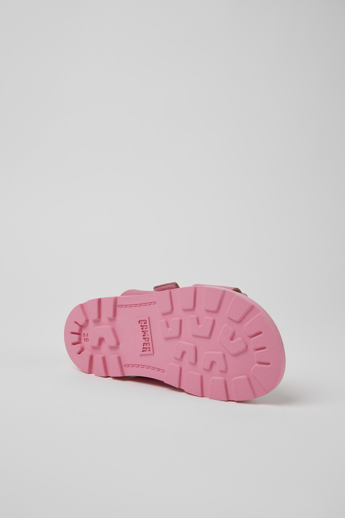 The soles of Brutus Sandal Pink leather sandals for kids