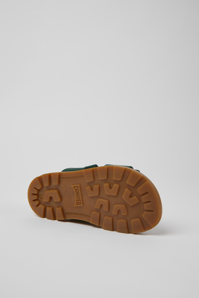 The soles of Brutus Sandal Green leather sandals for kids