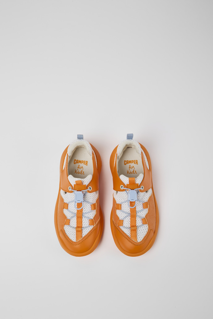 Overhead view of CRCLR White and orange sneakers for kids