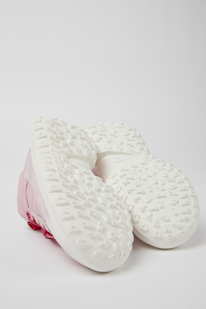 The soles of CRCLR Pink and white sneakers for girls