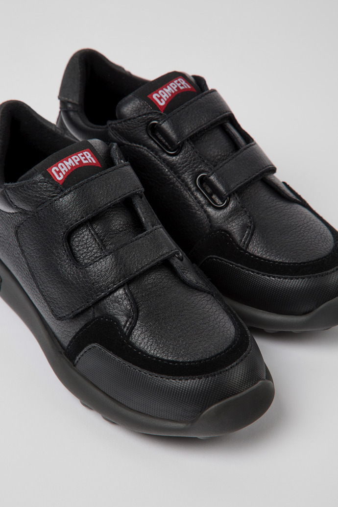 Close-up view of Driftie Black leather and textile sneakers