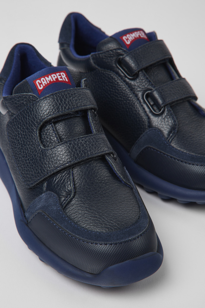 Close-up view of Driftie Navy blue leather and textile sneakers