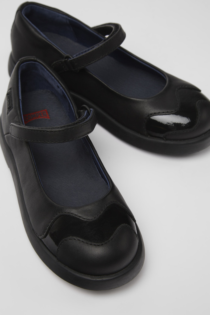 Close-up view of Twins Black leather Mary Jane flats