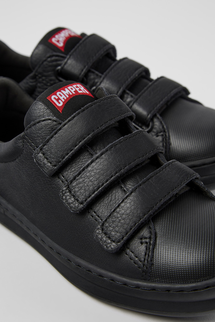 Close-up view of Runner Black leather and textile sneakers for kids