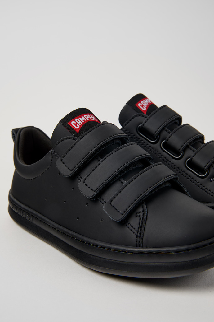 Close-up view of Runner Black Recycled Leather Kids' Sneakers.