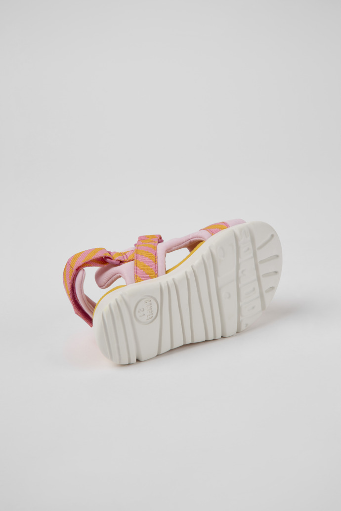 The soles of Oruga Pink and orange textile sandals for kids