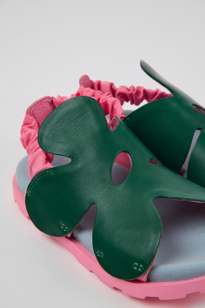Close-up view of Brutus Sandal Green and pink leather sandals for kids